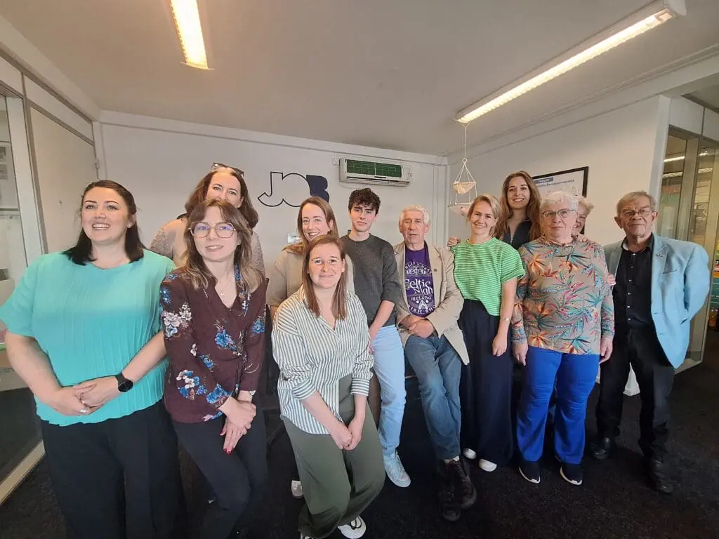 Voice of the Learner 2.0 Project Partners Stand Together Smiling at the Camera